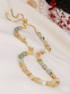 Pierres de Jade Pozłacany naszyjnik z elementami ozdobnymi - dł. 70 cm rozmiar: onesize. Brązowe naszyjniki Pierres de Jade, z cytrynem, pozłacane. Za 60,99 zł.