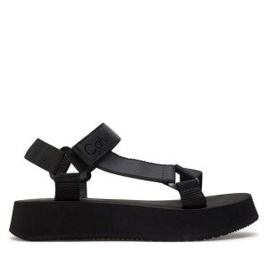 Sandały Calvin Klein Jeans. Czarne sandały Calvin Klein Jeans, bez wzorów, z jeansu, bez obcasa, na płaskiej podeszwie, bez zapięcia. Za 229,99 zł.
