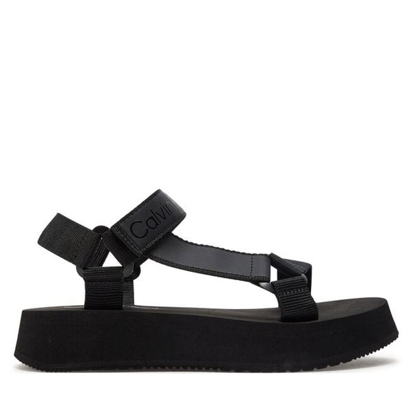 Sandały Calvin Klein Jeans. Czarne sandały Calvin Klein Jeans, bez wzorów, z jeansu, bez obcasa, na płaskiej podeszwie, bez zapięcia. Za 229,99 zł.