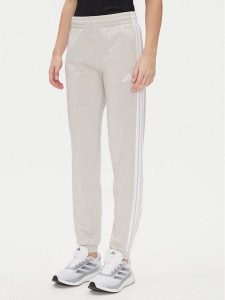 Adidas Spodnie dresowe Tricot 3-Stripes JD4536 Beżowy Regular Fit. Brązowe spodnie dresowe ADIDAS, xs, bez wzorów, z dresówki. Za 149,99 zł.