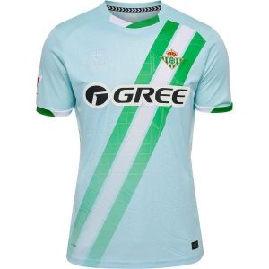 Zewnętrzna koszulka klubu Real Betis Sewilla 2025/26. Niebieskie bluzki Hummel, bez wzorów, sportowe, bez kołnierzyka, bez ramiączek. Za 350,50 zł.