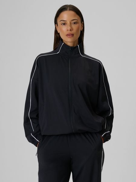 4F Bluza dresowa loose bez kaptura damska - czarna XS. Czarne bluzy 4f, l, bez wzorów, z dresówki, bez kaptura. Za 179,99 zł.