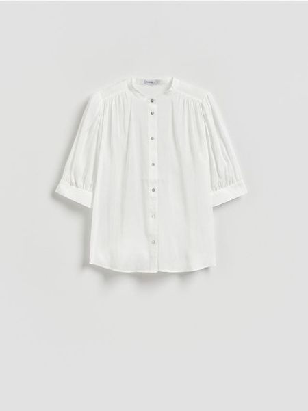 Koszula z krótkim rękawem - biały. Białe koszule Reserved, l, bez wzorów, z tkaniny, bez kołnierzyka, bez ramiączek. Za 99,99 zł.