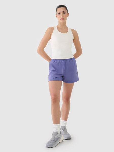 4F Spodenki treningowe szybkoschnące damskie - granatowe L. Niebieskie spodenki sportowe 4f, l, bez wzorów, z dzianiny, z podwyższonym stanem, na fitness i siłownię. Za 99,99 zł.