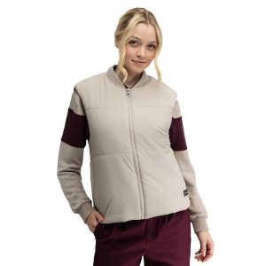 Damska ocieplana kamizelka golfowa Siroko Wedge-W Sand. Brązowe kamizelki SIROKO, bez wzorów, bez kołnierzyka, bez ramiączek, bez kaptura. Za 254,00 zł.