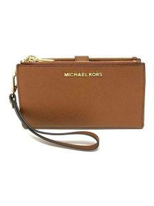 Michael Kors Skórzany portfel w kolorze karmelowym - 19 x 14 x 2 cm rozmiar: onesize. Brązowe portfele Michael Kors, bez wzorów, z materiału. Za 482,03 zł.