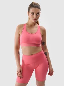 4F Legginsy kolarki treningowe z materiału z recyklingu damskie - koralowe S. Czerwone legginsy 4f, bez wzorów, z dzianiny, z podwyższonym stanem. W wyprzedaży za 59,99 zł.
