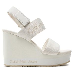 Sandały Calvin Klein Jeans. Białe sandały Calvin Klein Jeans, bez wzorów, z jeansu, bez obcasa, na koturnie, bez zapięcia. Za 319,99 zł.
