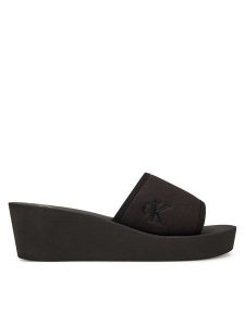 Calvin Klein Jeans Klapki Beach Wedge Slide Canvas YW0YW01725 Czarny. Czarne klapki Calvin Klein Jeans, bez wzorów, z jeansu, bez obcasa. Za 139,99 zł.
