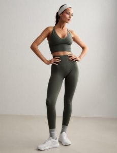 Damskie legginsy invisible scrunch, squat proof Shape Seamless zielone. Zielone legginsy AIM'N, bez wzorów, z dzianiny, z podwyższonym stanem. Za 296,00 zł.