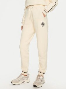 Guess Spodnie dresowe Nia V4BB06 KCHU1 Beżowy Regular Fit. Brązowe spodnie dresowe Guess, m, z aplikacjami, z bawełny. Za 379,99 zł.
