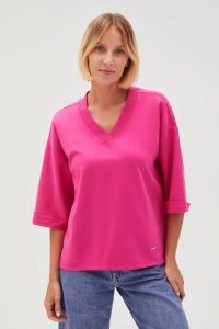 Bluza oversize z dekoltem w serek fuksjowa. Bluzy MOODO, l, bez wzorów, z bawełny, bez kaptura. Za 79,99 zł.