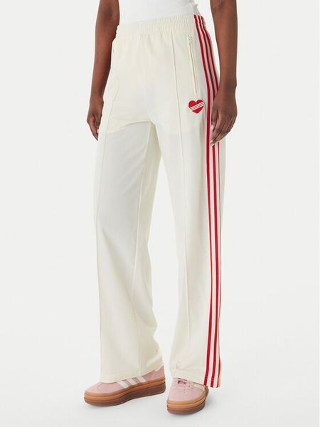 Adidas Spodnie dresowe Firebird KQ8056 Beżowy Loose Fit. Brązowe spodnie dresowe ADIDAS, xs, bez wzorów, z dresówki. Za 298,99 zł.