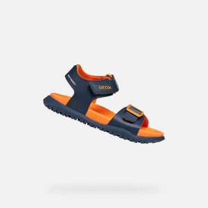 Sandały GEOX J SANDAL FUSBETTO BO Niebieski. Brązowe sandały Geox, bez wzorów, ze skóry, bez obcasa, bez zapięcia. Za 188,99 zł.