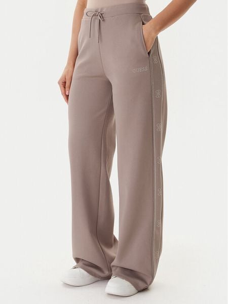 Guess Spodnie dresowe V5BB12 KCX22 Beżowy Wide Leg. Brązowe spodnie dresowe Guess, s, z aplikacjami, z dresówki. Za 279,99 zł.