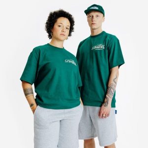 Koszulka z grafiką. Zielone bluzki DECATHLON, xl, bez wzorów, z bawełny, bez kołnierzyka, bez ramiączek. W wyprzedaży za 59,99 zł.