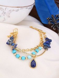 L'Atelier de Gaia Pozłacana bransoletka z lapis lazuli rozmiar: onesize. Niebieskie bransoletki L'Atelier de Gaia, z lazurytem, pozłacane. Za 74,63 zł.