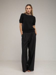 Tantra Spodnie w kolorze czarnym rozmiar: L. Czarne spodnie z wysokim stanem Tantra, bez wzorów, z materiału, z podwyższonym stanem. Za 269,11 zł.