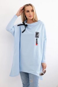 Bluza oversize z asymetrycznymi bokami błękitna. Niebieskie bluzy KESI, l, bez wzorów, z bawełny, bez kaptura. Za 209,11 zł.