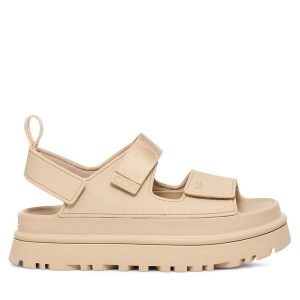 Sandały Ugg. Brązowe sandały Ugg, bez wzorów, bez obcasa, na koturnie, bez zapięcia. Za 399,99 zł.