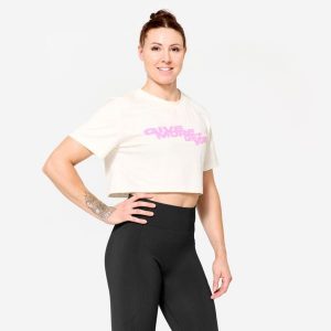Koszulka fitness damska Domyos crop top. Białe topy DOMYOS, m, bez wzorów, z bawełny, sportowe, bez kołnierzyka, bez ramiączek. W wyprzedaży za 39,99 zł.