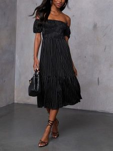 Milan Kiss Sukienka w kolorze czarno-białym rozmiar: L. Białe sukienki Milan Kiss, l, bez wzorów, z wiskozy, bez kołnierzyka, bez ramiączek, midi. Za 208,95 zł.