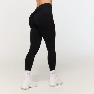 Legginsy damskie fitness z wysokim stanem Fierce V-back. Czarne legginsy GYMBEAM, bez wzorów, z elastanu, z podwyższonym stanem, długie. Za 110,90 zł.