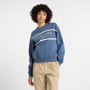Bluza damska New Balance WT51923VTI – niebieska. Niebieskie bluzy New Balance, m, z aplikacjami, z bawełny, bez kaptura. Za 249,99 zł.