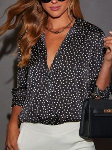 Milan Kiss Bluzka w kolorze czarno-białym rozmiar: L. Czarne bluzki Milan Kiss, l, bez wzorów, bez kołnierzyka, bez ramiączek. Za 126,99 zł.