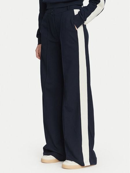 Guess Spodnie dresowe V6YB26 K5139 Granatowy Relaxed Fit. Niebieskie spodnie dresowe Guess, xxs, z aplikacjami, z bawełny. Za 434,99 zł.