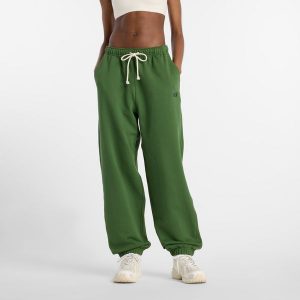 Spodnie damskie New Balance WP41513DAE – zielone. Zielone spodnie z wysokim stanem New Balance, bez wzorów, z bawełny, z podwyższonym stanem. Za 379,99 zł.