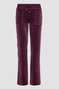 JUICY COUTURE Śliwkowe damskie spodnie welurowe Del Ray Pocket Pant, Rozmiar XS. Fioletowe spodnie dresowe Juicy Couture, s, bez wzorów, z dresówki. Za 499,99 zł.