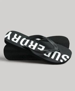 Superdry Code Core Sport Klapki z gumy – Czarny/Biały. Czarne klapki Superdry, bez wzorów, z gumy, bez obcasa. Za 145,75 zł.