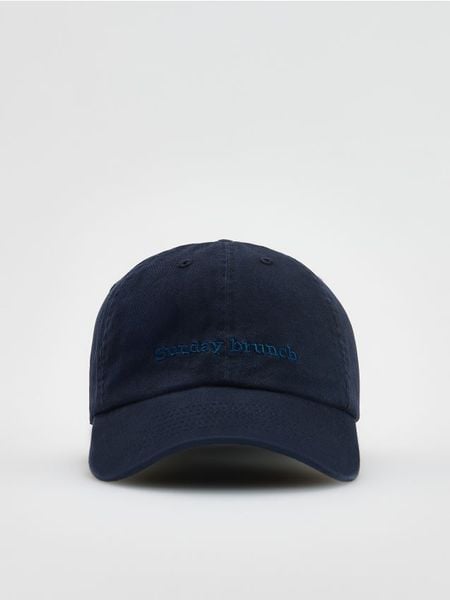 Czapka z daszkiem - niebieski. Niebieskie czapki Reserved, bez wzorów. W wyprzedaży za 25,99 zł.