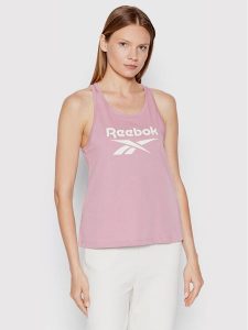 Reebok Top Identity HN6866 Fioletowy Relaxed Fit. Fioletowe topy Reebok, xs, bez wzorów, z bawełny, bez kołnierzyka, bez ramiączek. Za 49,99 zł.
