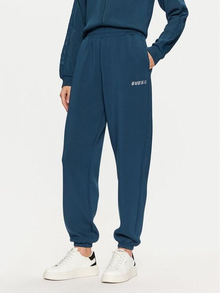 Guess Spodnie dresowe V4BB13 K7UW2 Niebieski Regular Fit. Niebieskie spodnie dresowe Guess, xl, z aplikacjami, z dresówki. Za 189,99 zł.