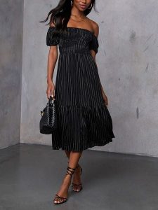 LA Angels Sukienka w kolorze czarnym rozmiar: M. Czarne sukienki LA Angels, m, bez wzorów, z wiskozy, bez kołnierzyka, bez ramiączek, midi. Za 173,99 zł.