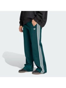 Adidas Spodnie dresowe Firebird KG3701 Zielony Loose Fit. Zielone spodnie dresowe ADIDAS, xs, bez wzorów, z dresówki. Za 299,99 zł.