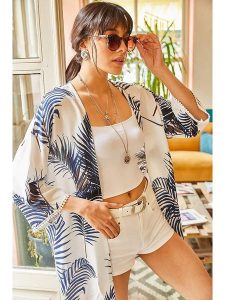 Olalook Kimono "Olalook" w kolorze kremowym rozmiar: L. Brązowe swetry oversize Olalook, l, bez wzorów, z wiskozy, bez ramiączek. Za 57,06 zł.