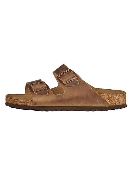 Birkenstock Skórzane klapki "Arizona" w kolorze jasnobrązowym rozmiar: 40. Brązowe klapki Birkenstock, bez wzorów, z otwartym noskiem, bez obcasa. Za 405,61 zł.