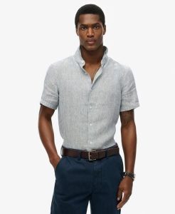 Superdry Koszula Vacation lniana krótki rękaw Navy Ticking Linen. Niebieskie koszule Superdry, s, bez wzorów, z tkaniny, bez kołnierzyka, bez ramiączek. Za 322,70 zł.