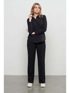 &Co Woman Spodnie "Charlotte" w kolorze czarnym rozmiar: L. Czarne spodnie z wysokim stanem &Co Woman, bez wzorów, z materiału, z podwyższonym stanem. Za 219,45 zł.