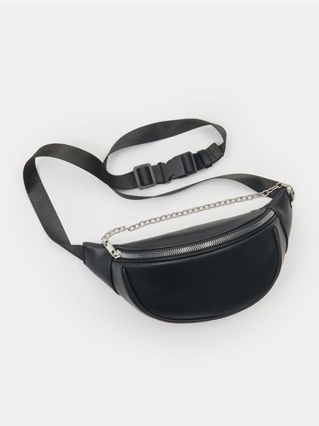 Saszetka nerka z imitacji skóry - czarny. Czarne nerki i saszetki Sinsay, bez wzorów, ze skóry. W wyprzedaży za 17,99 zł.