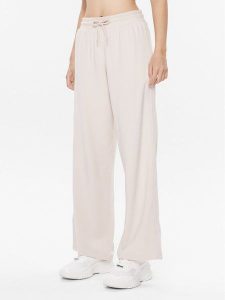 Tommy Hilfiger Spodnie dresowe UW0UW04771 Beżowy Relaxed Fit. Brązowe spodnie dresowe TOMMY HILFIGER, s, bez wzorów, z dresówki. Za 199,99 zł.