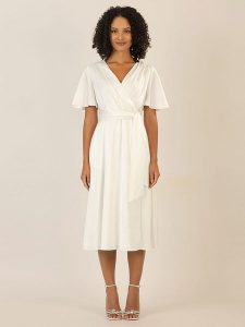 APART Sukienka w kolorze kremowym rozmiar: 36. Brązowe sukienki Apart, bez wzorów, z tkaniny, bez kołnierzyka, bez ramiączek, midi. Za 186,19 zł.