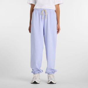 Spodnie damskie New Balance WP41513DYK – fioletowe. Fioletowe spodnie dresowe New Balance, xl, bez wzorów, z bawełny. Za 359,99 zł.