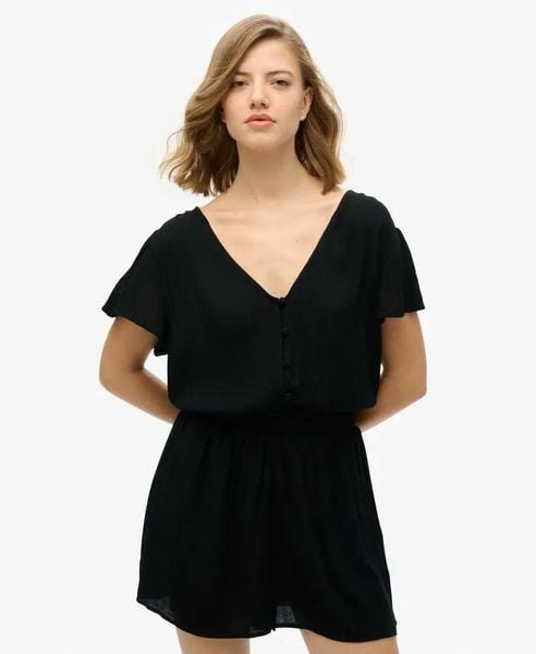 Superdry Krótki kombinezon z nadrukiem, 100% wiskoza, czarny – Black. Czarne kombinezony Superdry, bez wzorów, z materiału, bez kołnierzyka, bez ramiączek, krótkie. Za 232,25 zł.