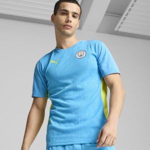 Koszulka piłkarska na trening Manchester City 24/25. Bluzki Puma, m, bez wzorów, z materiału, sportowe, bez kołnierzyka, bez ramiączek. Za 179,99 zł.