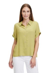 CARTOON Bluzka w kolorze zielonym rozmiar: 42. Zielone bluzki Cartoon, bez wzorów, z wiskozy, bez kołnierzyka, bez ramiączek. Za 74,46 zł.