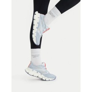 Buty do biegania Reebok. Niebieskie buty sportowe Reebok, bez wzorów, bez zapięcia, do biegania. Za 489,99 zł.